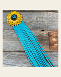 Leather Yellow Daisy with Turquoise Fringe on a warm cream background