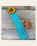 Leather Yellow Gardenia with Turquoise Fringe on a warm cream background