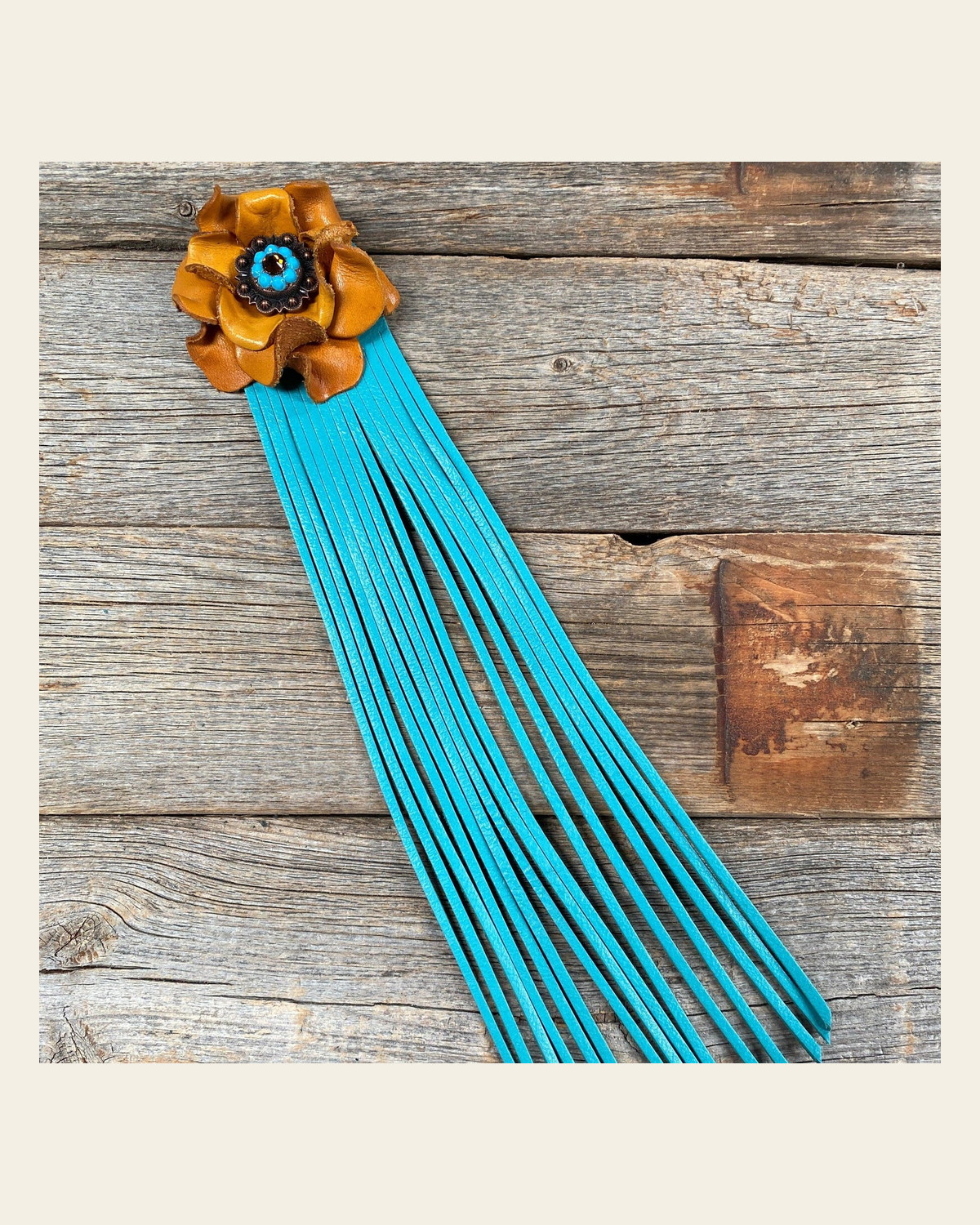 Leather Yellow Rose with Turquoise Fringe on a warm cream background