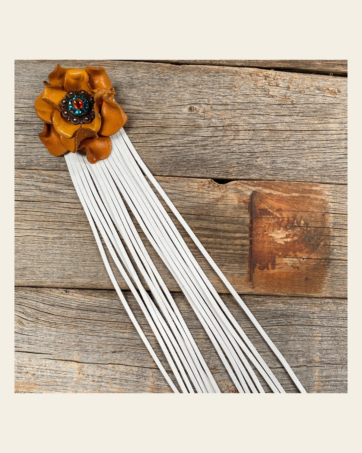 Leather Yellow Rose with White Fringe on a warm cream background