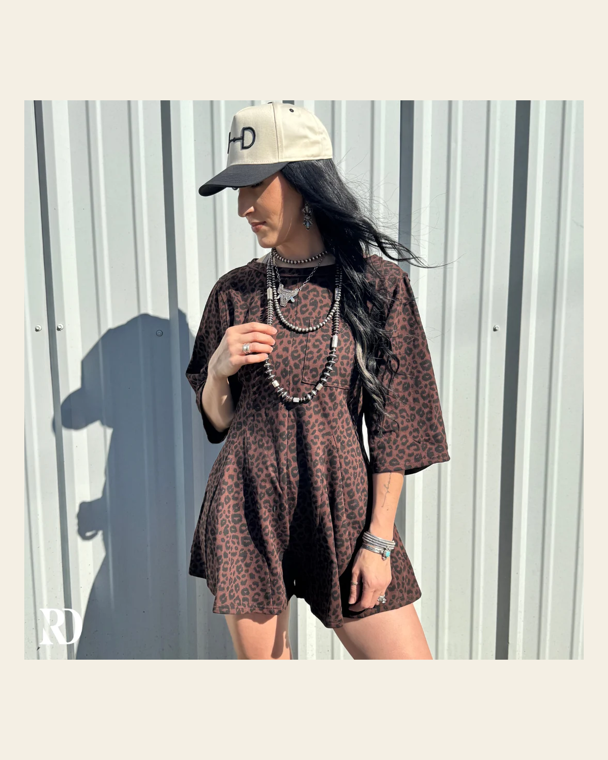 Lena Leopard | Romper on a warm cream background