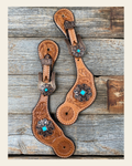 Light Floral Spur Straps - Copper Fleur-De-Lis Western Conchos #SS114 on a warm cream background