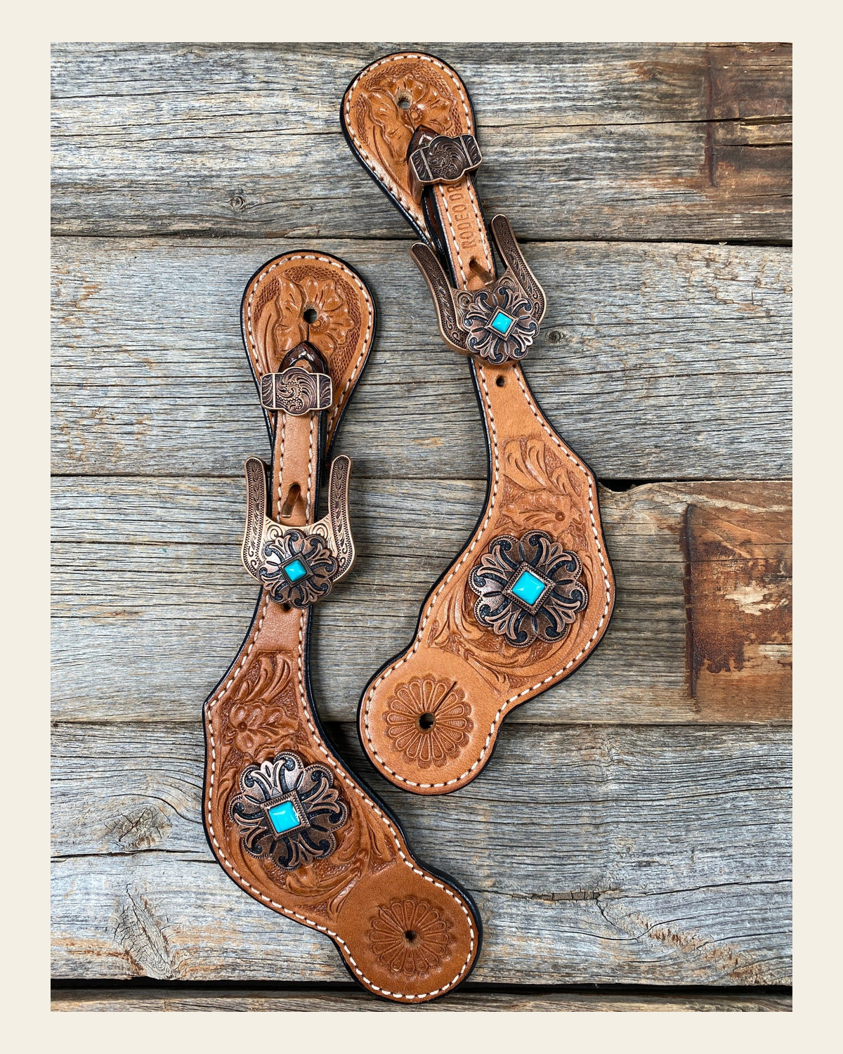 Light Floral Spur Straps - Copper Fleur-De-Lis Western Conchos #SS114 on a warm cream background