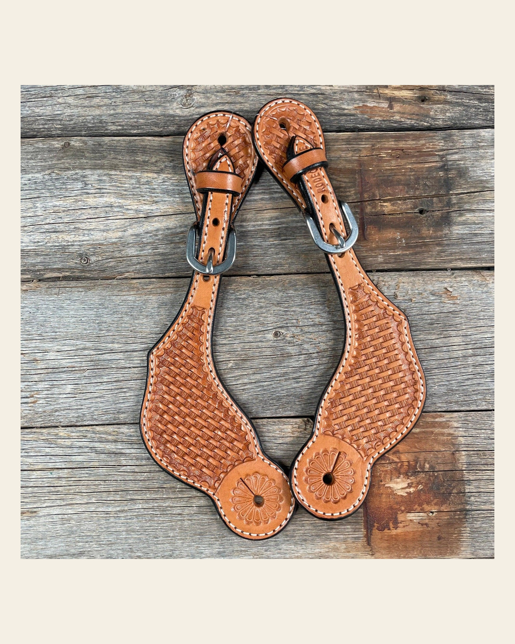 Light Oil Genuine Leather Basketweave Tooled Spur Straps on a warm cream background