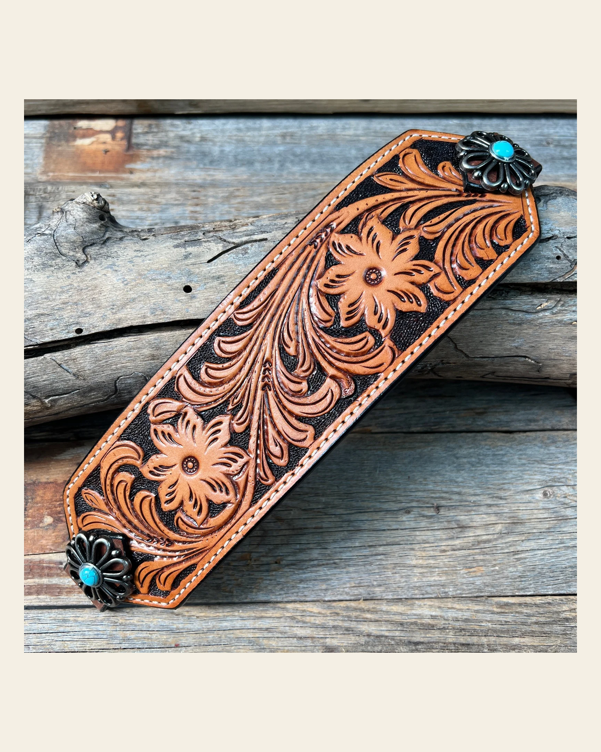 Light Oil Floral Bronc Noseband With Antique Silver Flower Conchos on a warm cream background