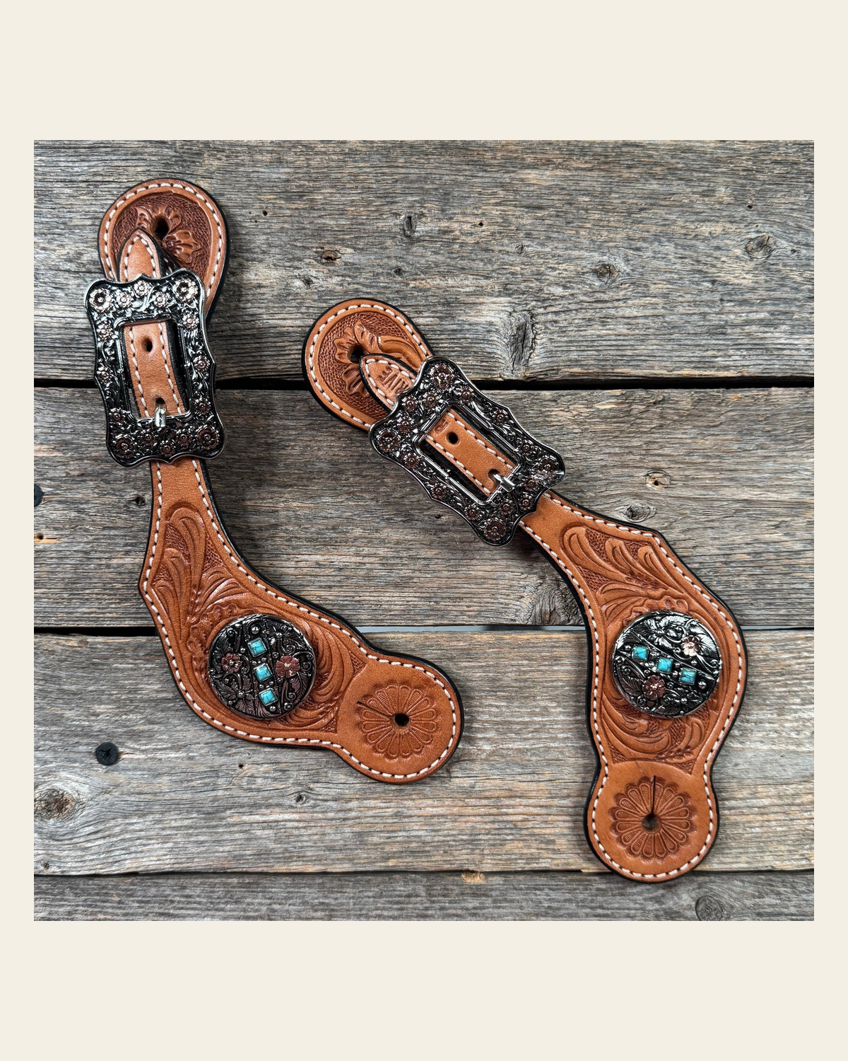 Light Oil Floral Spur Straps | Antique Silver and Copper Conchos #SS145 on a warm cream background