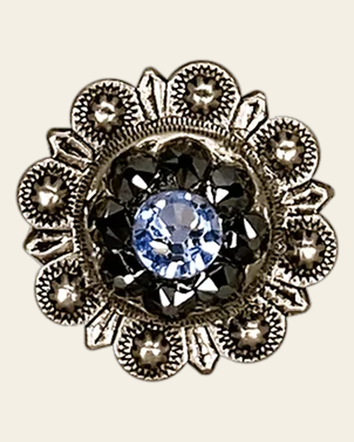 Light Sapphire & Jet Antique Silver 1" European Crystal Concho on a warm cream background