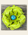 Lime Gardenia Flower With Round Turquoise Cabochon on a warm cream background
