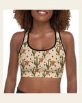 Longhorn Ranch Cactus Padded Sports Bra on a warm cream background