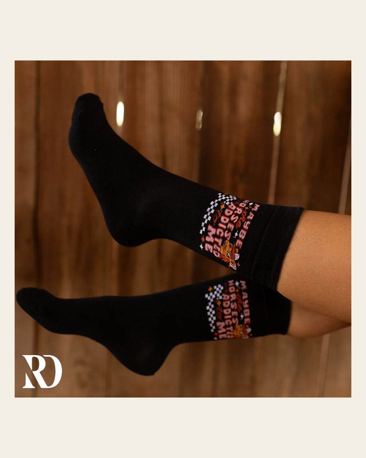 Maybe The Horses Are Addicted To Me Socks on a warm cream background