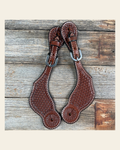 Medium Oil Genuine Leather Basketweave Tooled Spur Straps on a warm cream background