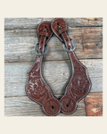 Medium Oil Genuine Leather Floral Tooled Spur Straps on a warm cream background