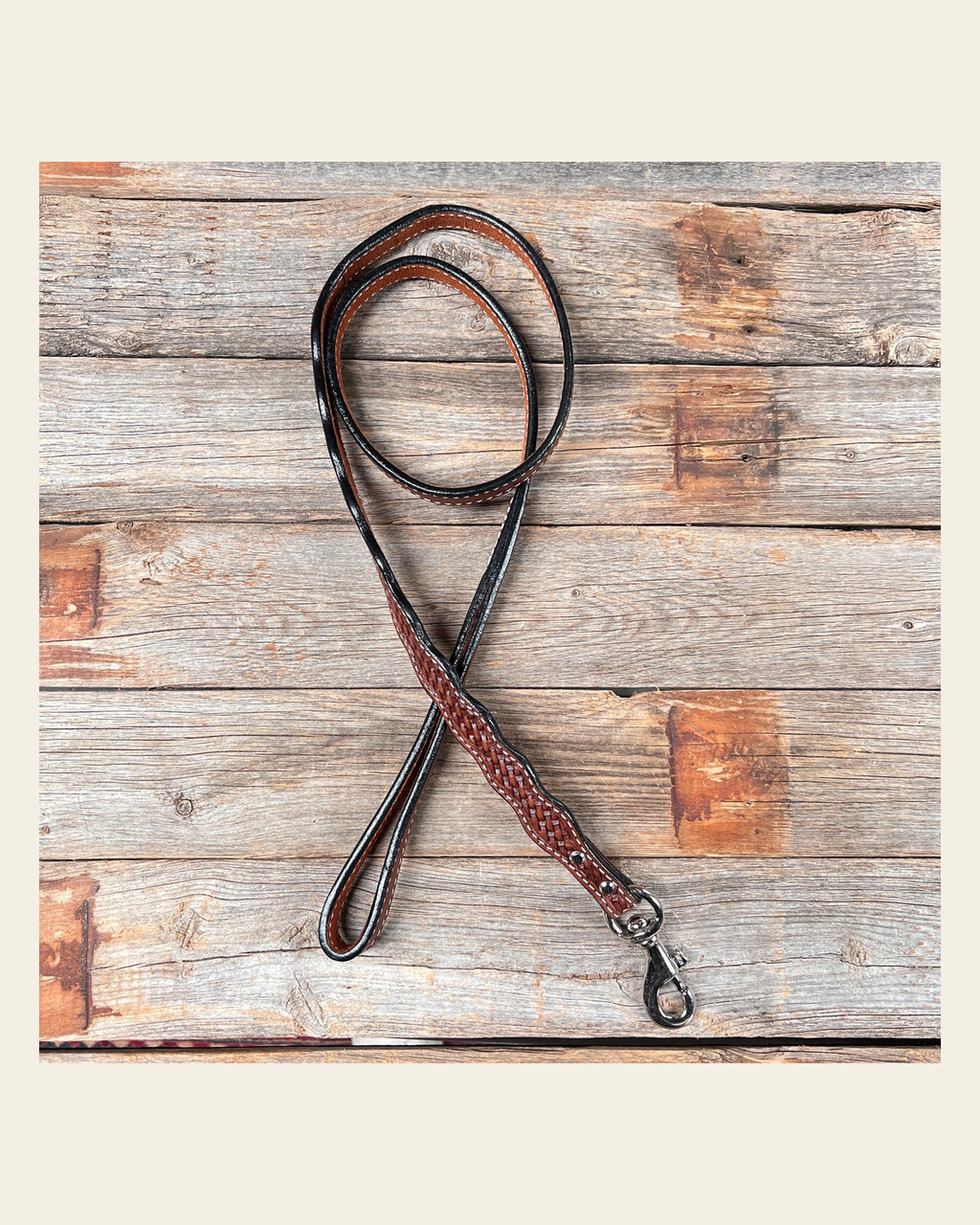 Medium Oil Genuine Leather leash 4' x 1" wide on a warm cream background