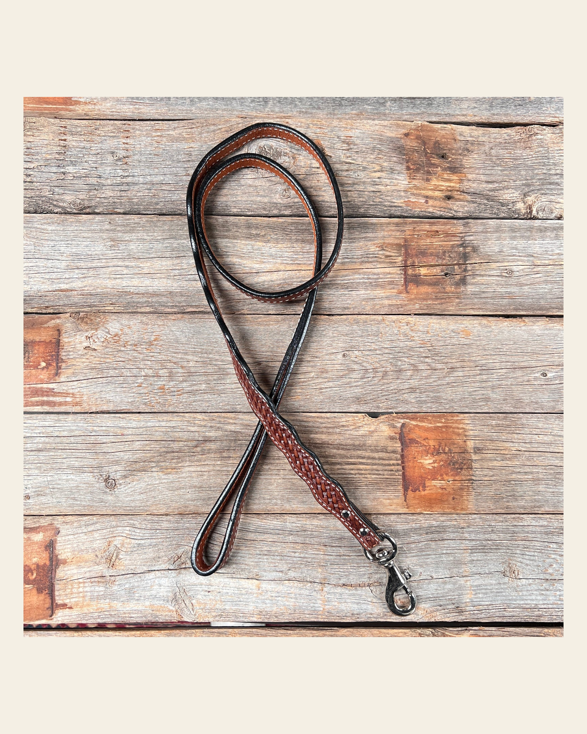 Medium Oil Genuine Leather leash 4' x 1" wide on a warm cream background