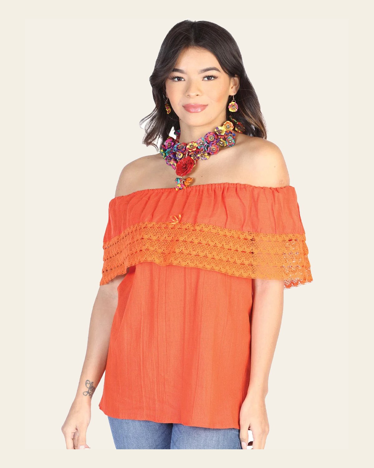 Mexican Artisanal Blouse 50% Cotton, %50 Polyester Orange 602512 on a warm cream background