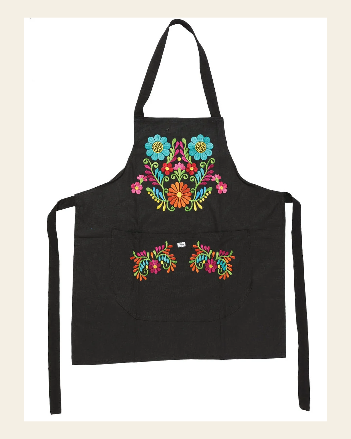Mexican Artisanal Embroidered Apron 50% Cotton, %50 Polyester Bllack 603197 on a warm cream background