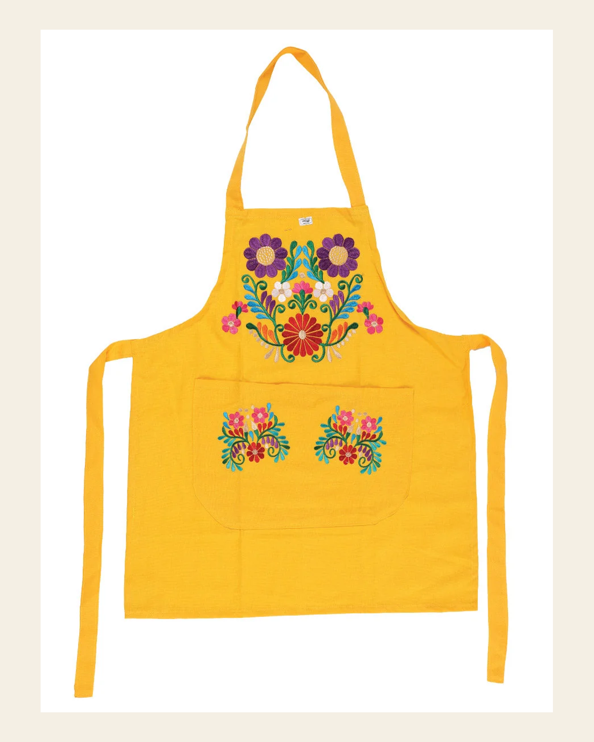 Mexican Artisanal Embroidered Apron 50% Cotton, %50 Polyester Yellow 603198 on a warm cream background