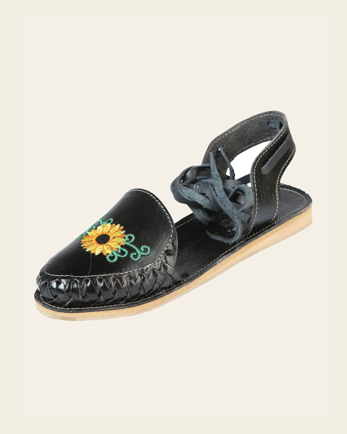 Mexican Artisanal Sandals Leather Black 603919 on a warm cream background