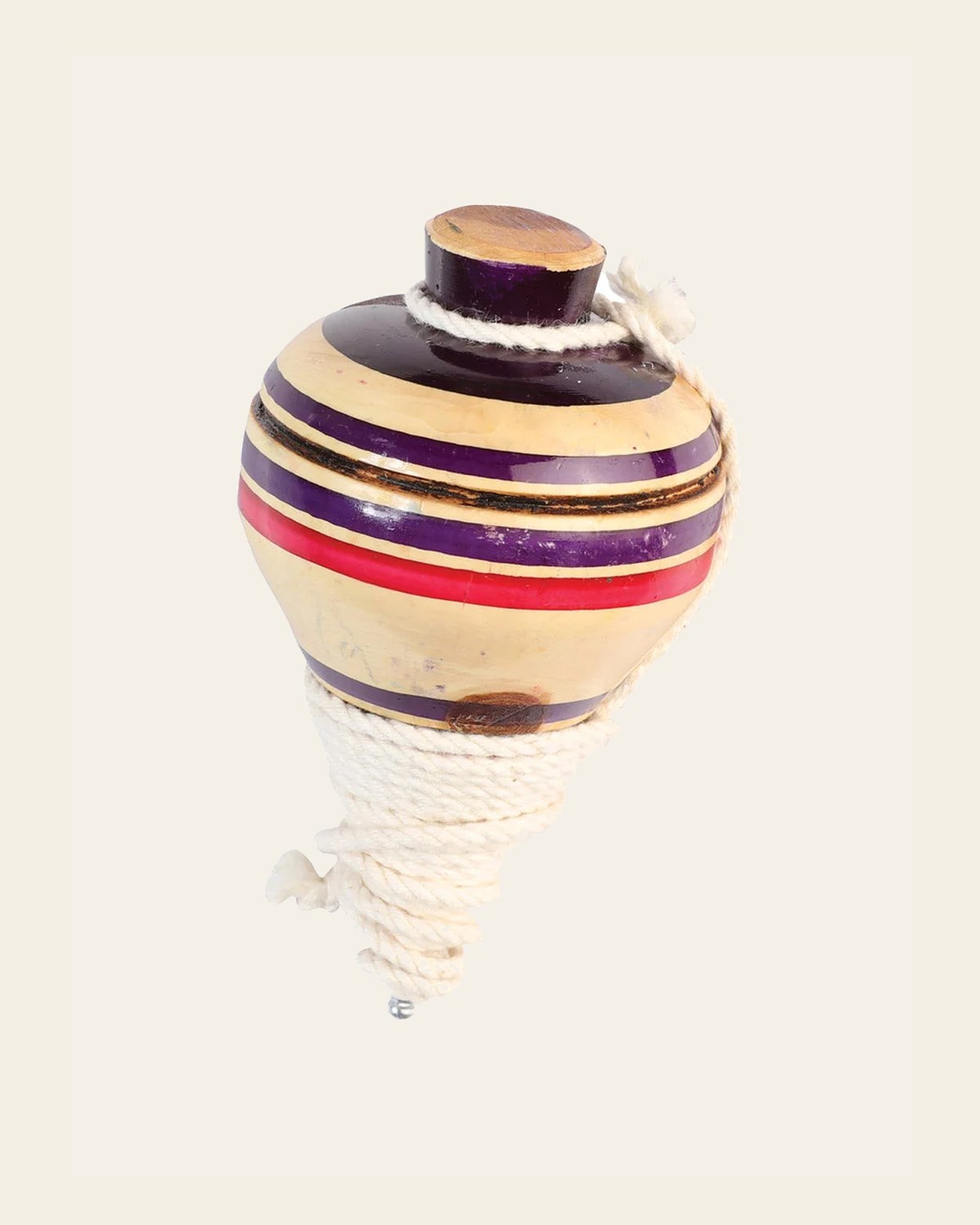 Mexican Artisanal Toy Trompo Wood Multicolor 602412 on a warm cream background