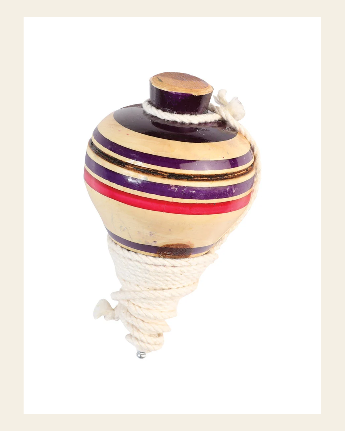 Mexican Artisanal Toy Trompo Wood Multicolor 602412 on a warm cream background
