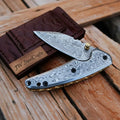Handmade Damascus Steel Folding Knife with Dark Wood Handle & Leather Sheath