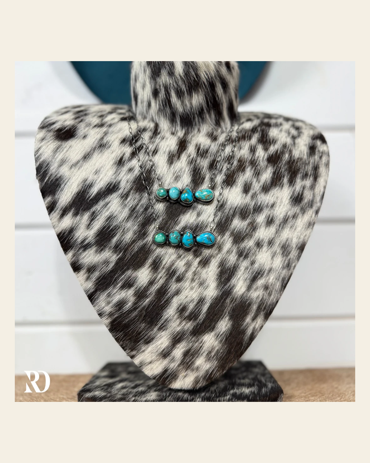 Multi-stone Kingman Turquoise Bar Necklace By Eli Skeets on a warm cream background