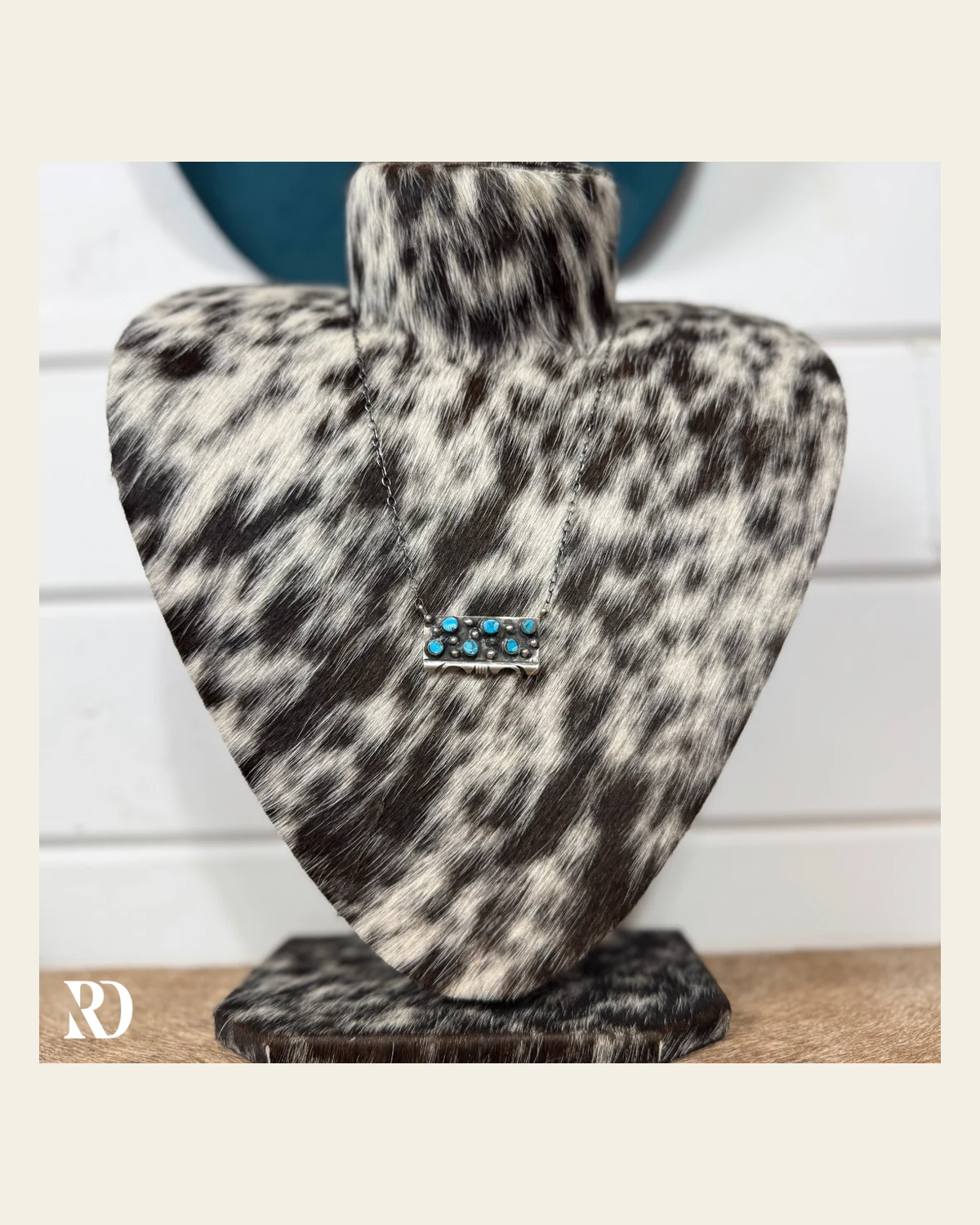 Multi-stone Kingman Turquoise Bar Necklace By Steve Francisco on a warm cream background