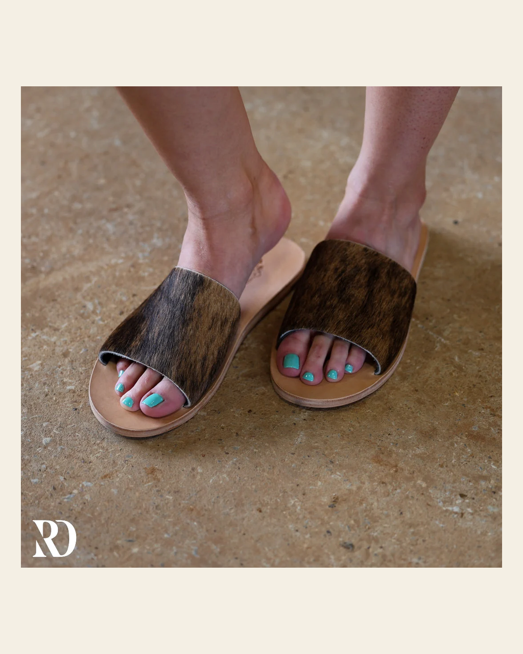Nadia Cowhide | Slides on a warm cream background