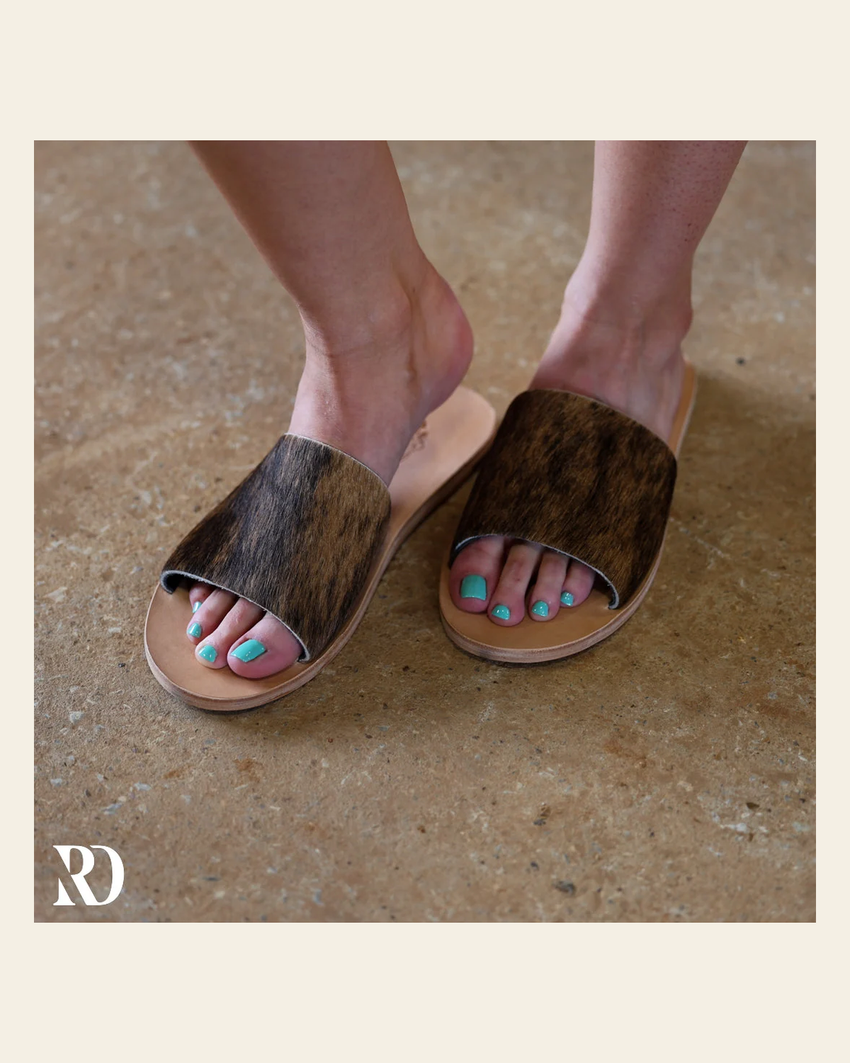 Nadia Cowhide | Slides on a warm cream background