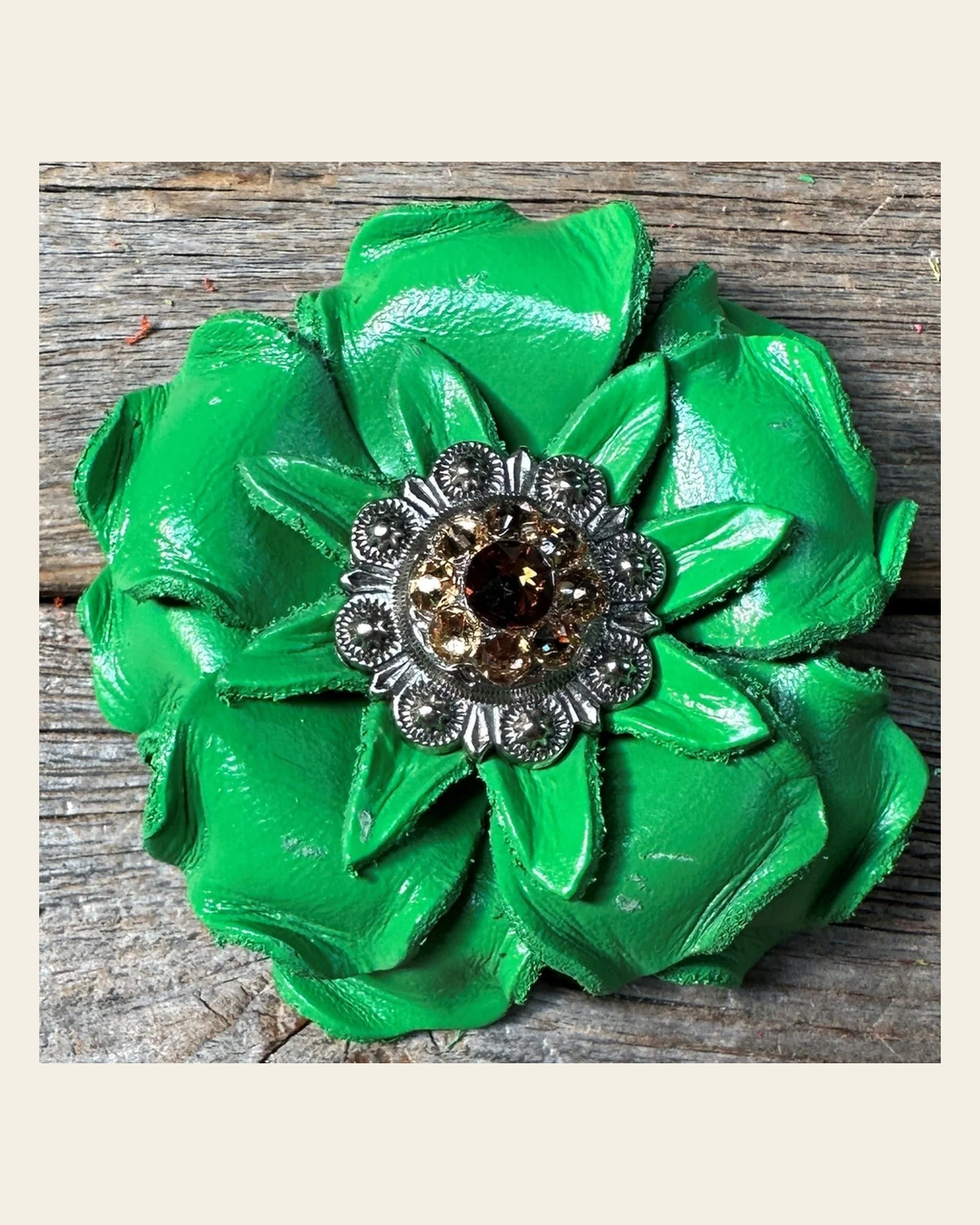 Neon Green Gardenia Flower With Antique Silver Topaz & Champagne 1" Concho on a warm cream background