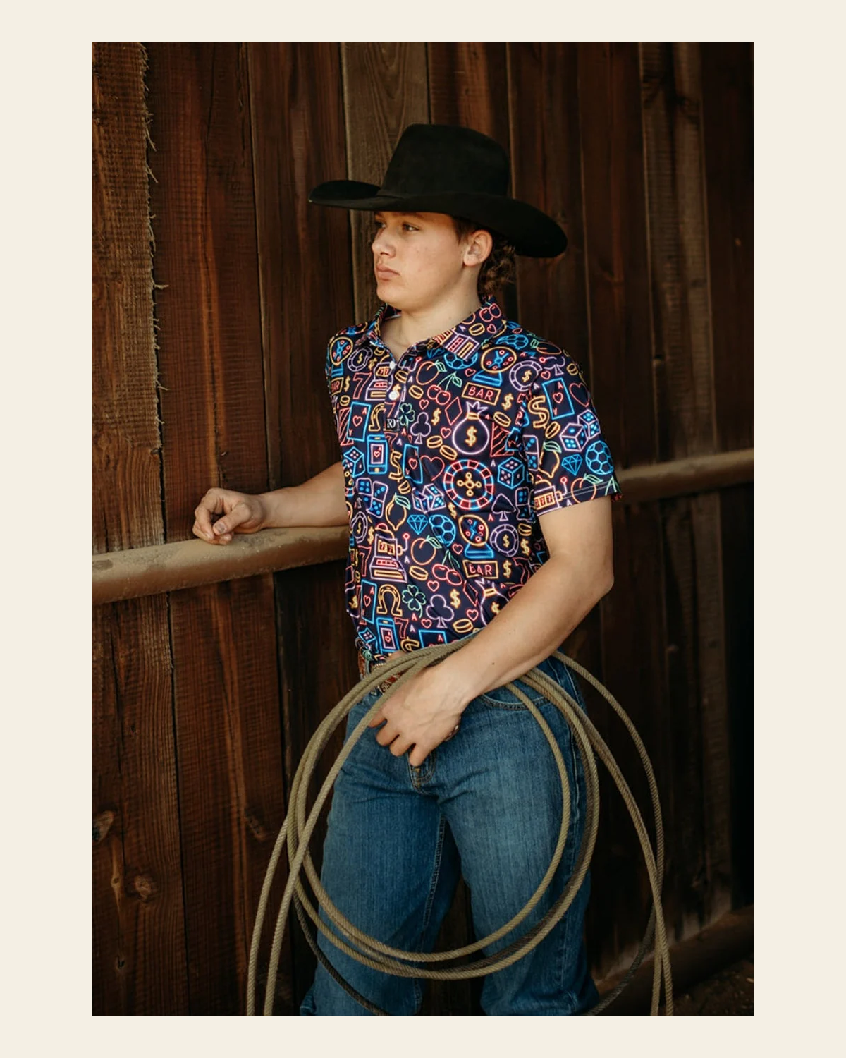 Neon Lights Men's Performance Polo on a warm cream background