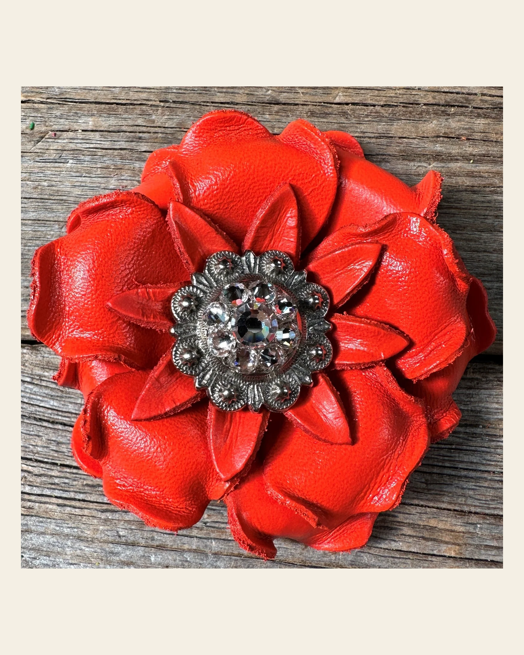 Neon Orange Gardenia Flower With Antique Silver Clear 1" Concho on a warm cream background