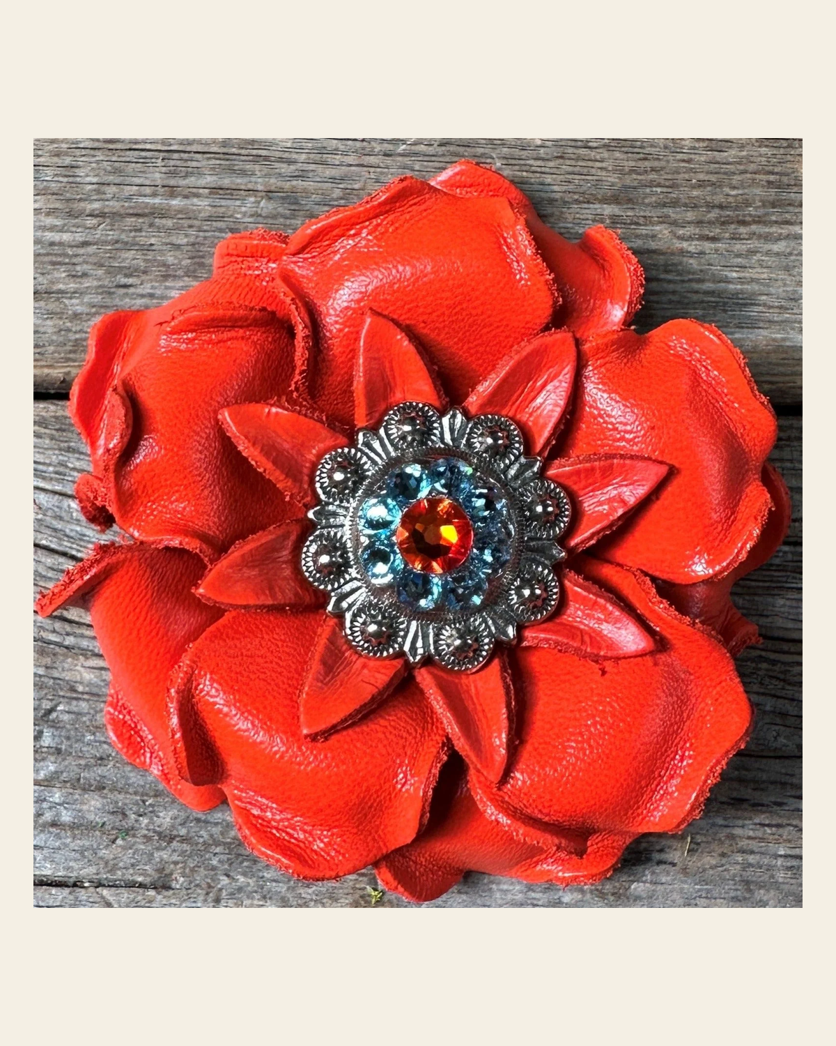 Neon Orange Gardenia Flower With Antique Silver Fire Opal & Aqua 1" Concho on a warm cream background