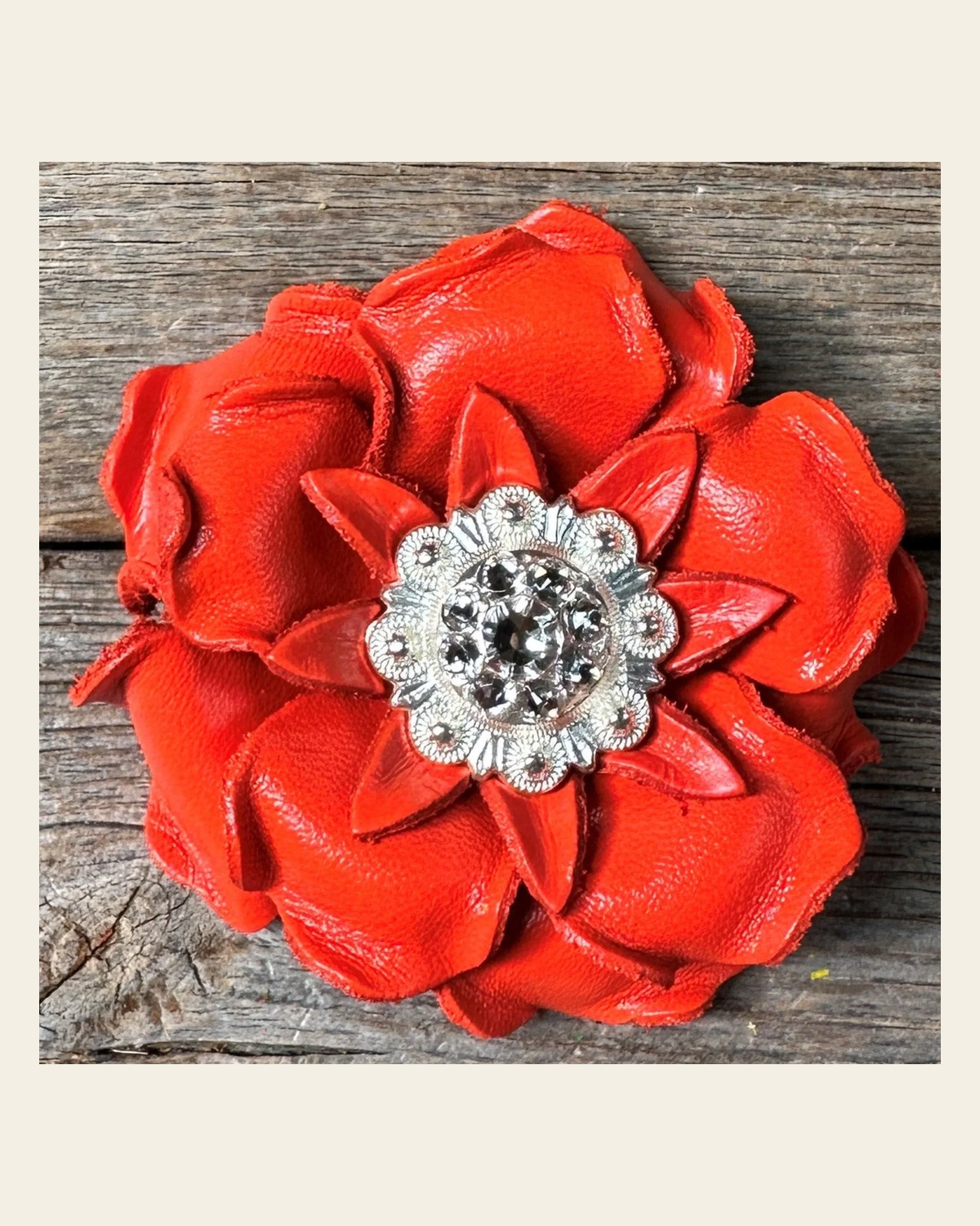 Neon Orange Gardenia Flower With Bright Silver Clear 1" Concho on a warm cream background
