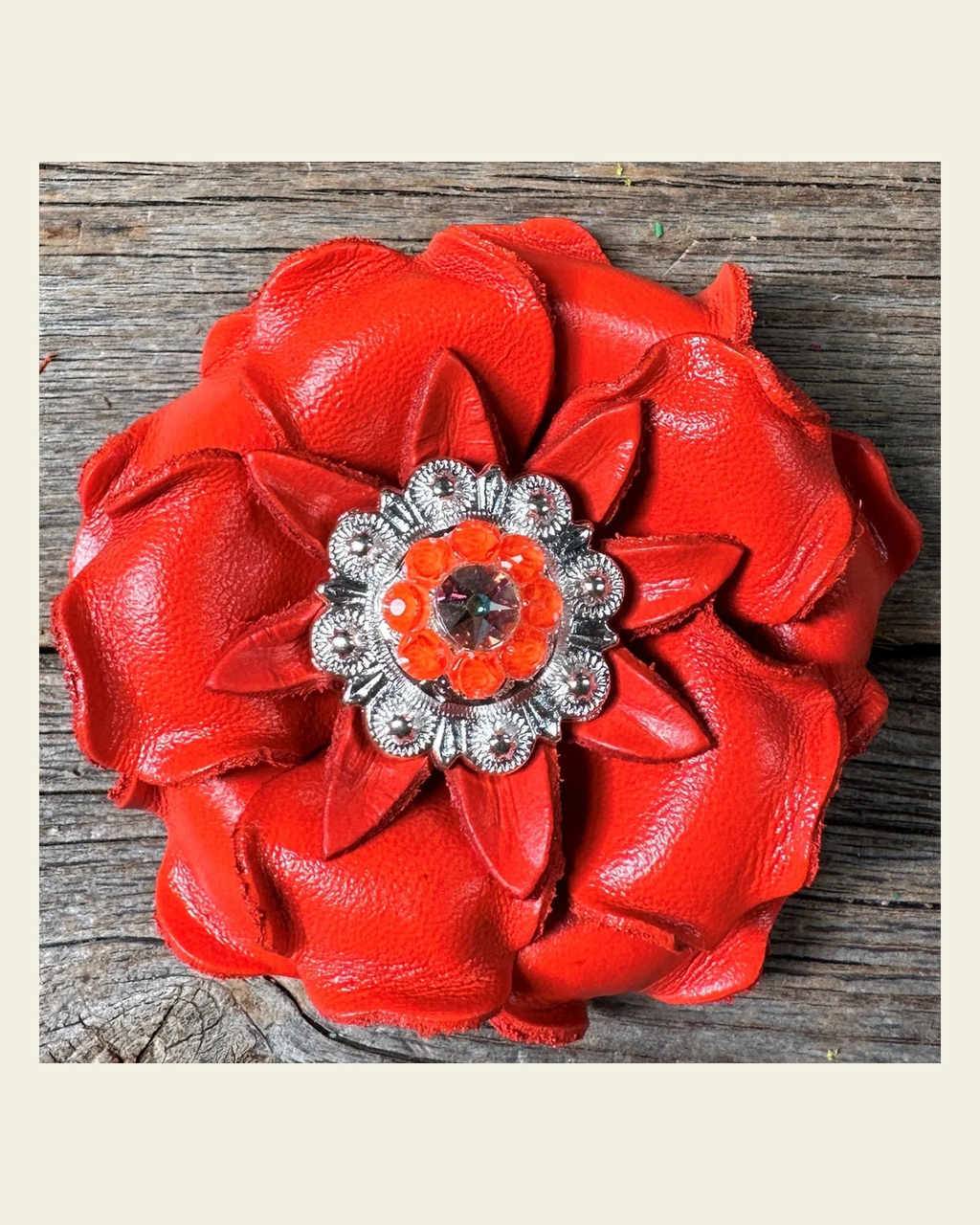 Neon Orange Gardenia Flower With Bright Silver Neon Orange & AB 1" Concho on a warm cream background