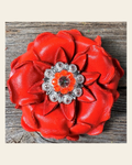 Neon Orange Gardenia Flower With Bright Silver Neon Orange & AB 1" Concho on a warm cream background