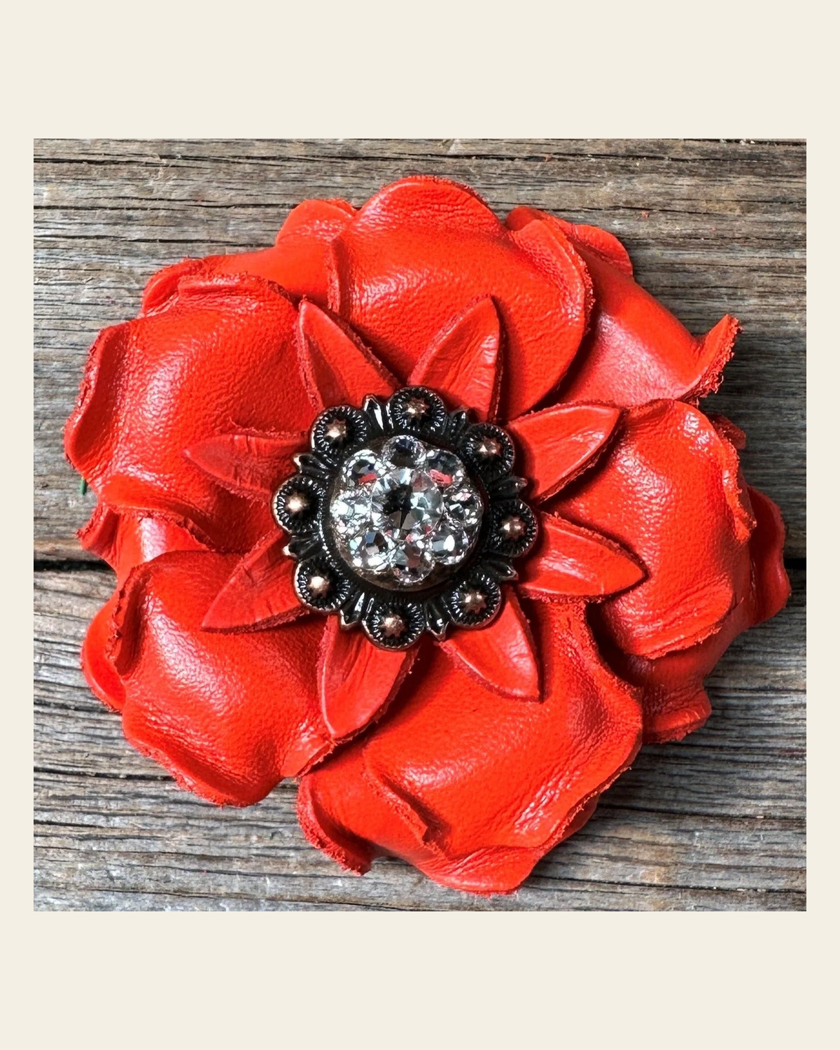 Neon Orange Gardenia Flower With Copper Clear 1" Concho on a warm cream background