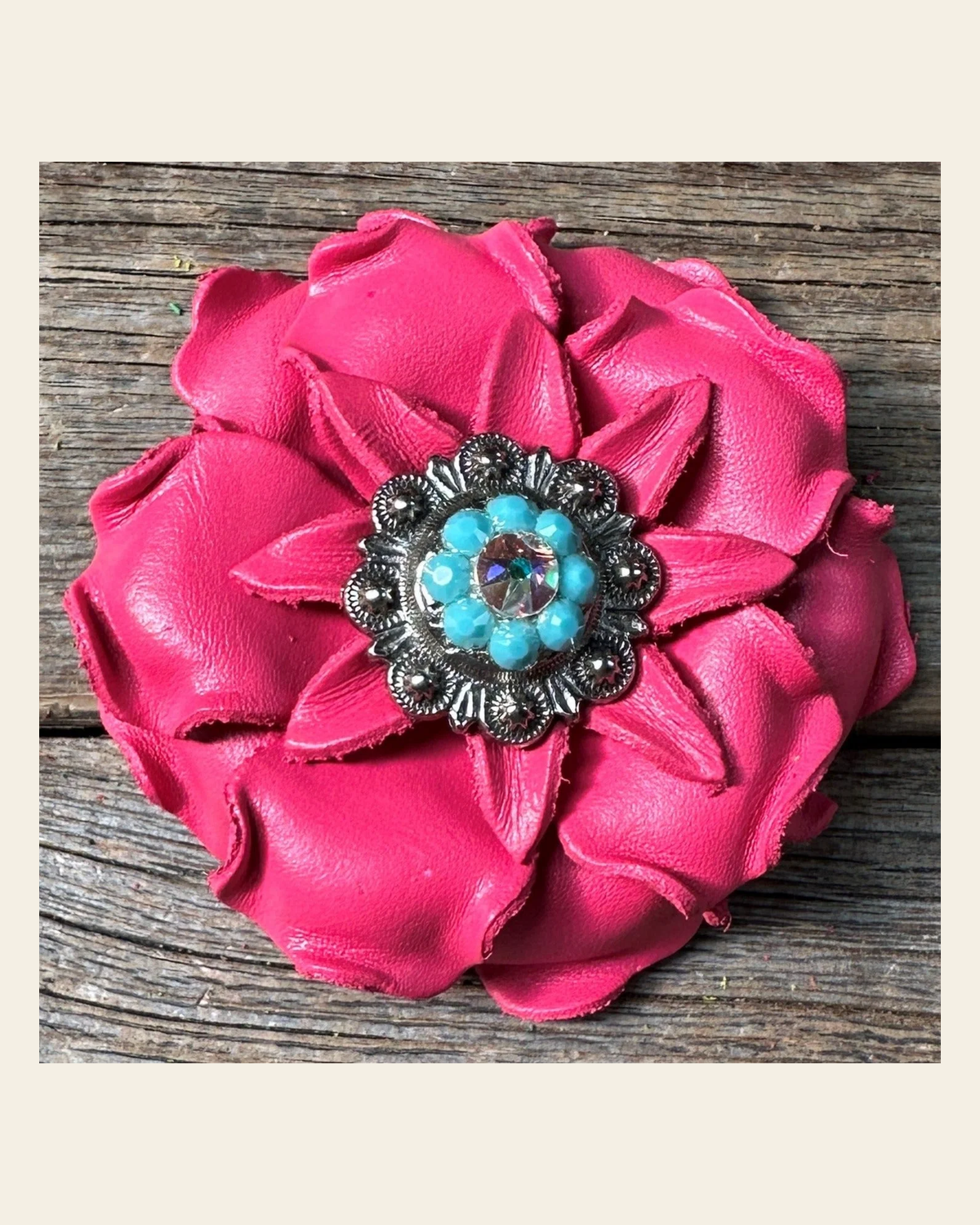Neon Pink Gardenia Flower With Antique Silver Turquoise & AB 1" Concho on a warm cream background
