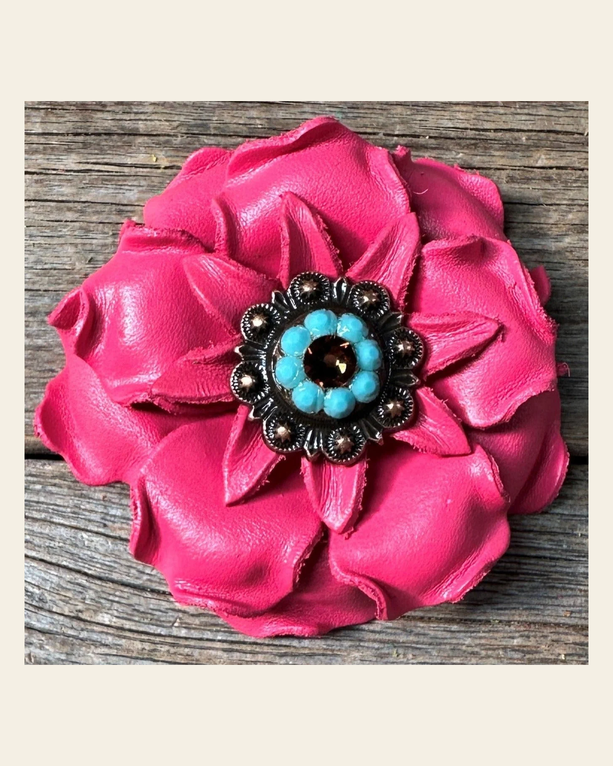 Neon Pink Gardenia Flower With Copper Topaz & Turquoise 1" Concho on a warm cream background