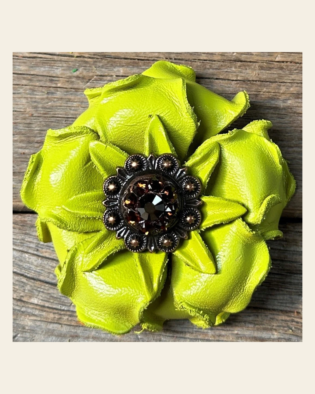 Neon Lime Gardenia Flower With Copper Jet & Topaz 1" Concho on a warm cream background