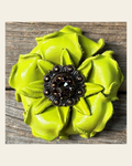 Neon Lime Gardenia Flower With Copper Jet & Topaz 1" Concho on a warm cream background