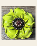 Neon Lime Gardenia Flower With Copper Pink & Champagne 1" Concho on a warm cream background