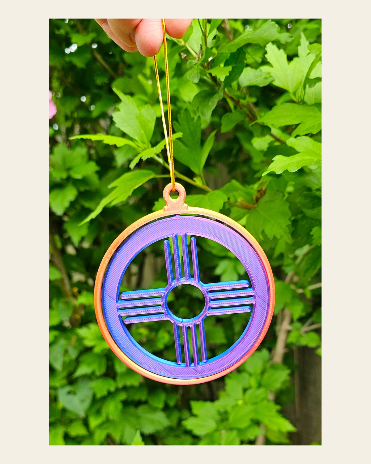 New Mexico Zia Ornament Large on a warm cream background