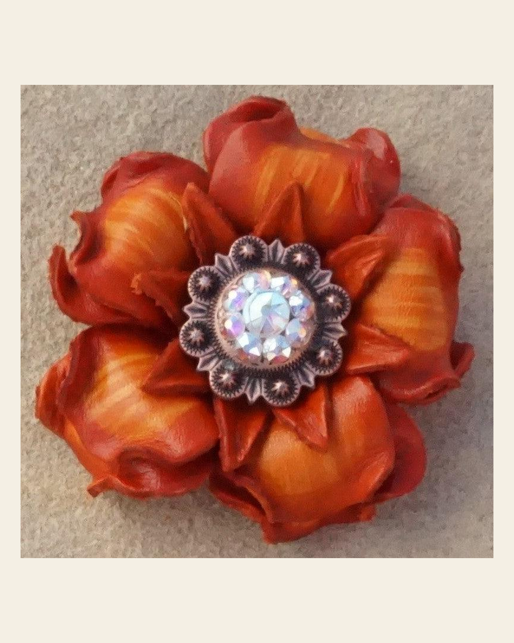 Orange Gardenia Flower With Copper AB 1" Concho on a warm cream background