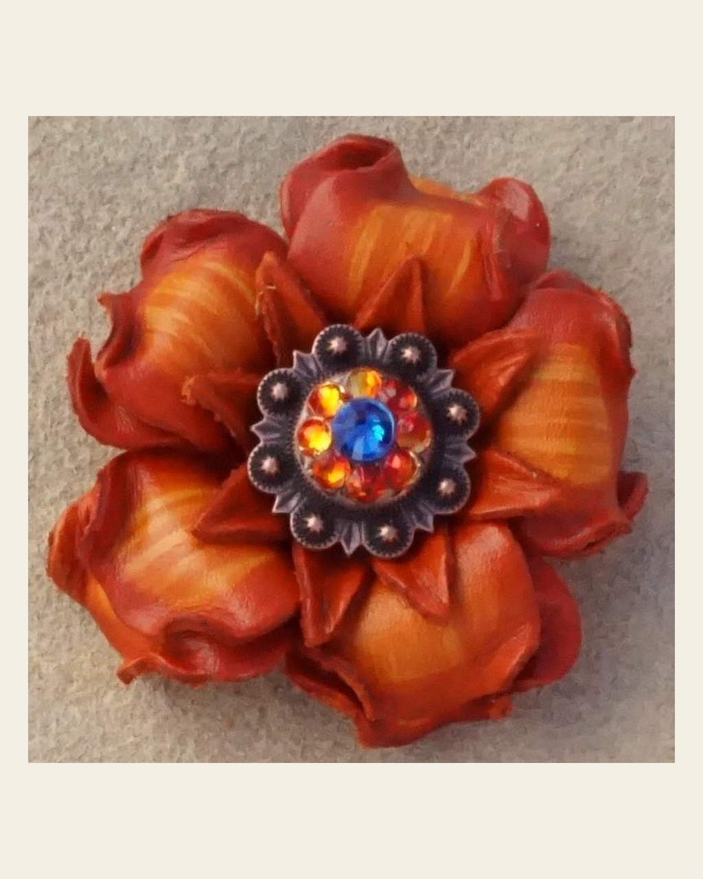 Orange Gardenia Flower With Copper Capri & Fire Opal 1" Concho on a warm cream background