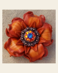 Orange Gardenia Flower With Copper Capri & Fire Opal 1" Concho on a warm cream background
