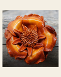 Orange Gardenia Leather Flower on a warm cream background