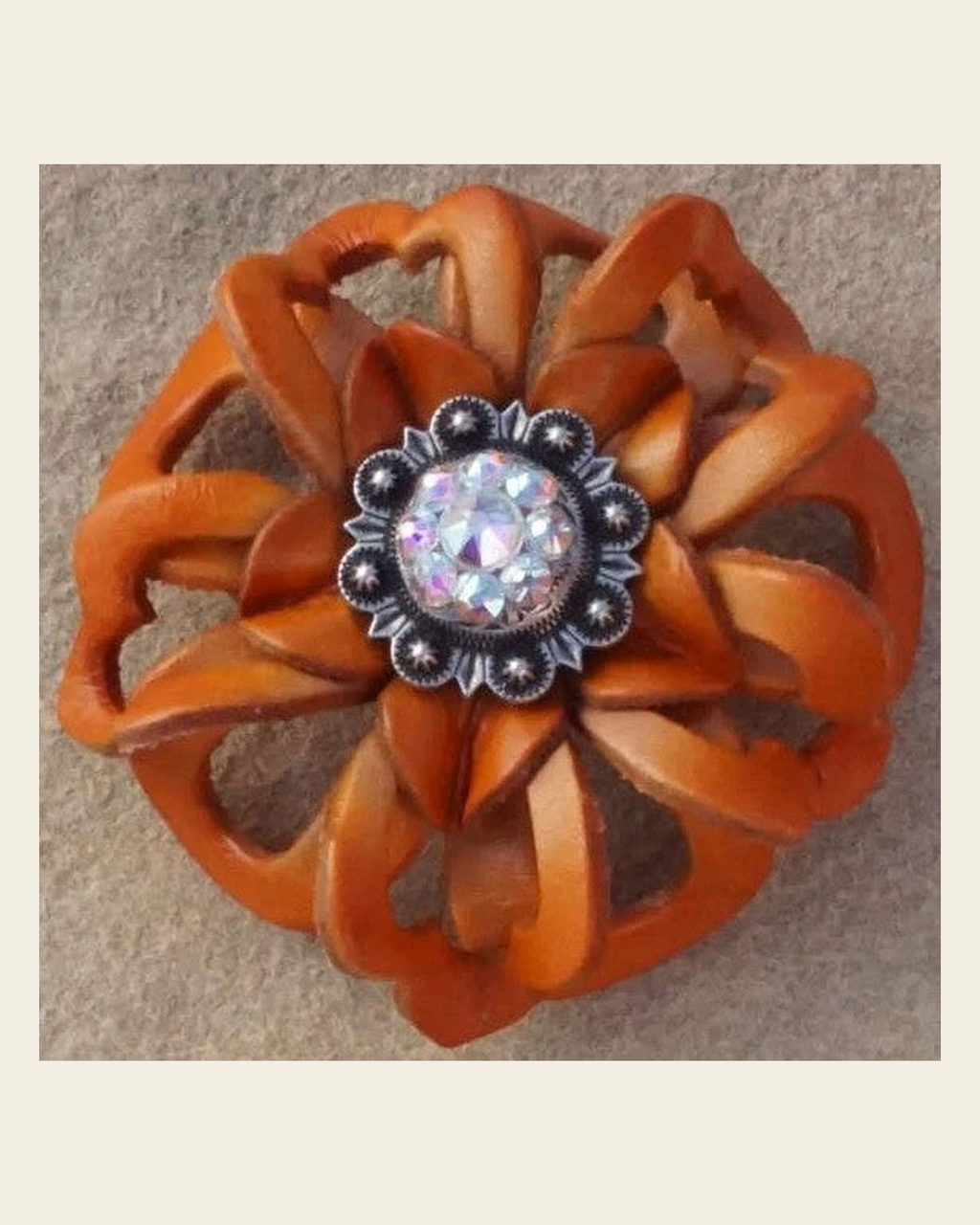 Orange Lotus Flower With Antique Silver AB 1" Concho on a warm cream background