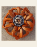 Orange Lotus Flower With Antique Silver Topaz/Champagne 1" Concho on a warm cream background