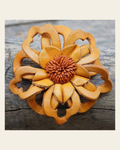 Orange Lotus Leather Flower on a warm cream background